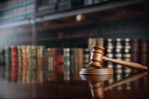 bookshelf with gavel on table 