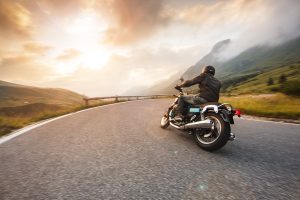 Motorcycle driver riding on street