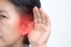 Woman trying to hear for Tepezza side effect blog post
