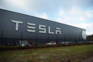 image of Tesla sign on building for Tesla's Autopilot blog post