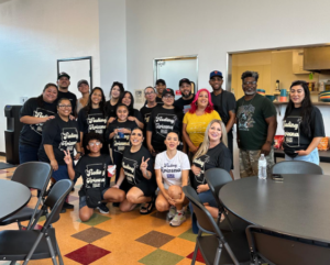 volunteers pose at A New Leaf outreach event in Surprise, AZ