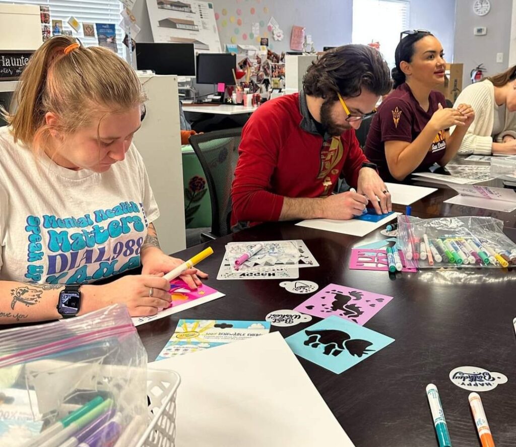 volunteers working on birthday bags at maggie's place