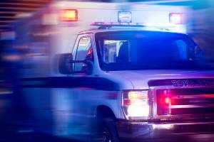 ambulance with lights on speeding down road
