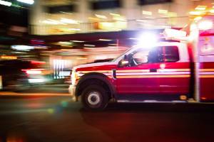 ambulance racing down road