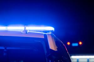police cruiser with lights on at night
