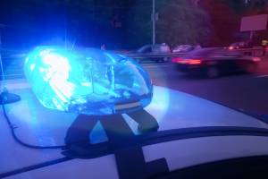 blue police light on top of car