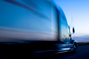 semi-truck traveling on interstate at night