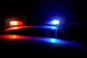 top of police car with lights and dark background