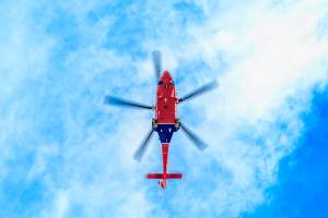 underside of helicopter in the sky