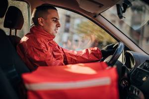 driver delivering food in car