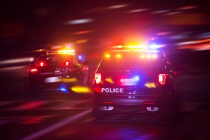 several police cars working emergency scene