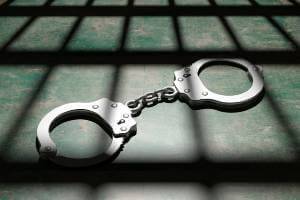 handcuffs on floor of prison cell