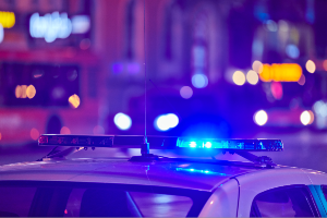 police car at busy intersection