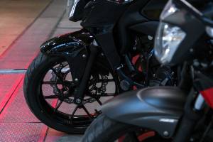 motorcycle wheel on concrete and metal ground