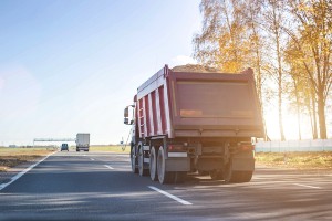 dump truck traveling on the road