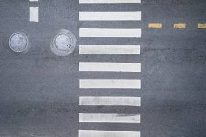 white crosswalk lines on road