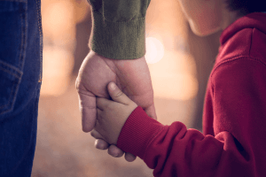 parent grabbing childs hand