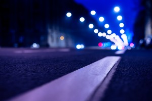 pedestrian crosses mid-block at night