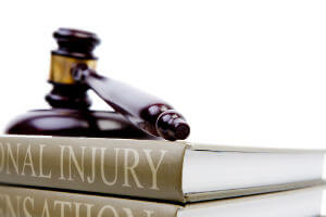 personal injury law book and gavel