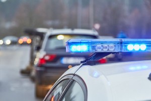 police car attending crash scene