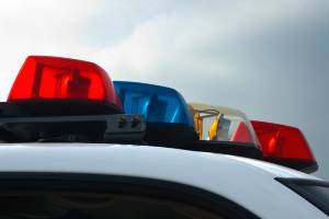 police car lights under cloudy sky