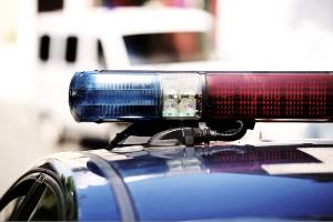 red and blue police light on top of car