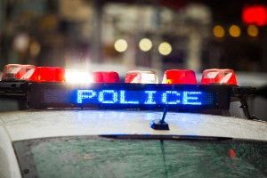 top of cop car at scene flashing lights