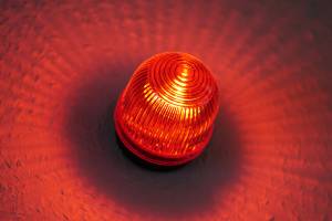 red light blaring on wall
