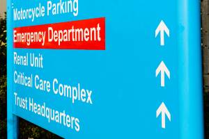 blue sign for hospital emergency department