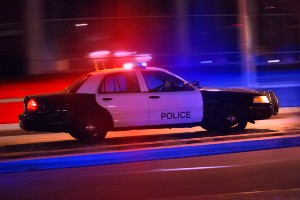 police car speeding while still dark out