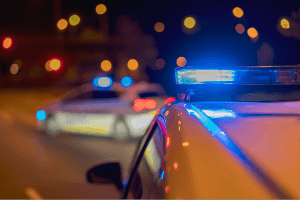 two police cars responding at night