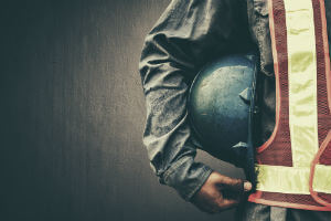 construction worker holding helmet
