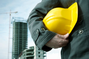 worker holding hat